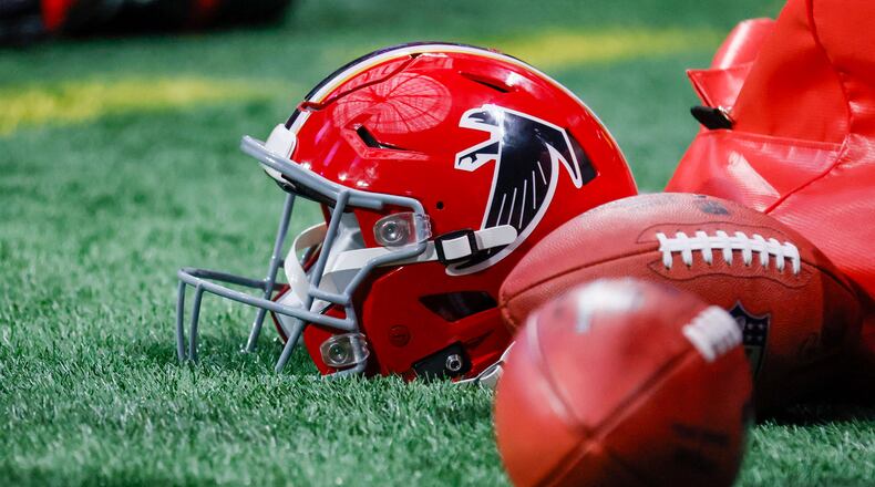 A Falcons helmet seats on the ground before the Falcons face the New Orleans Saints on Sunday, Sept. 29, at Mercedes-Benz Stadium in Atlanta. 
(Miguel Martinez/ AJC)