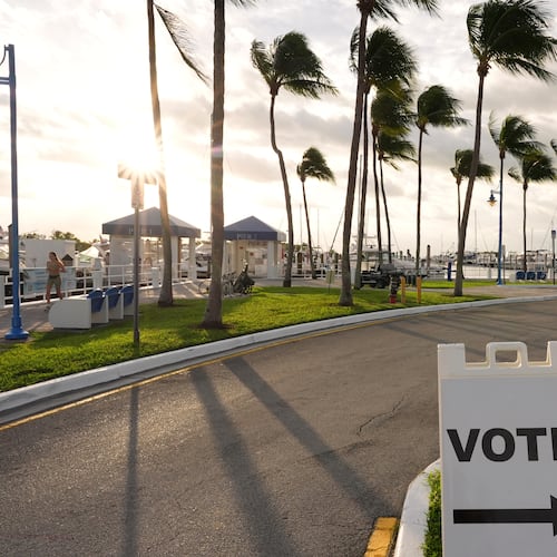 Signs indicate a polling place at Miami City Hall, on Election Day, Tuesday, Nov. 4, 2025, in Miami. (AP Photo/Rebecca Blackwell)