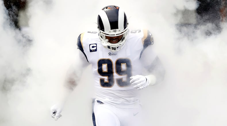 Rams'  Aaron Donald runs onto the field as he is introduced before the game against the New Orleans Saints Sept. 15, 2019, at Los Angeles Memorial Coliseum in Los Angeles.