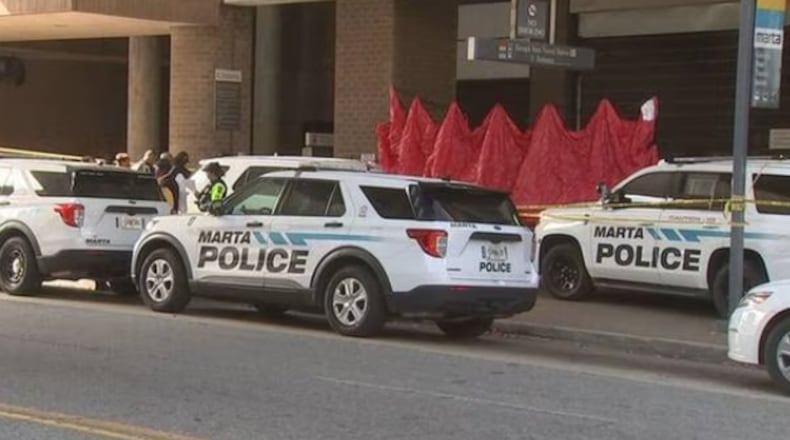 A man was arrested Tuesday after he allegedly shot a man sitting on a bench at the Georgia State MARTA station, police said.