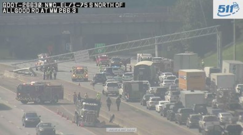 An exit sign collapsed on I-75 North just before the Canton Road exit, causing massive traffic delays Wednesday evening.
