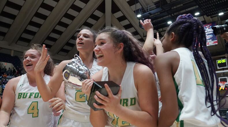 Buford High School players celebrate their win over Kell at the Class AAAA girls title basketball game at the Macon Centreplex, Friday March 6, 2020, in Macon. Tami Chappell for the Atlanta Journal Constitution