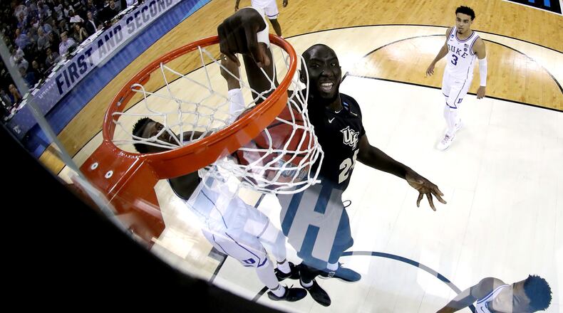 UCF's Tacko Fall dunks the ball against the Duke Blue Devils in the second round game of the 2019 NCAA Men's Basketball Tournament March 24, 2019, at Colonial Life Arena  in Columbia, S.C.