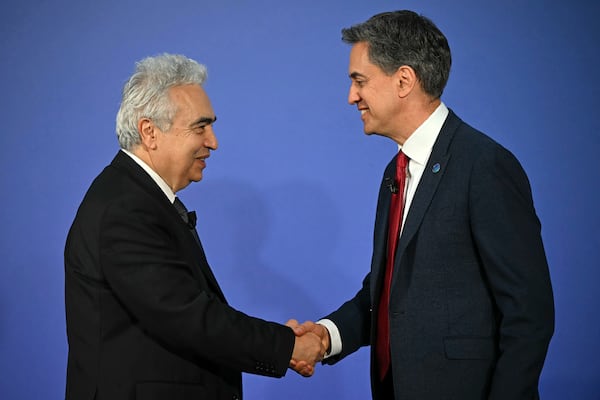 Britain's Secretary for Energy Security Ed Miliband, right, and Fatih Birol, Executive Director of the International Energy Agency (IEA) shake hands on day one of the International Summit on the Future of Energy Security at Lancaster House in London, Thursday April 24, 2025. (Justin Tallis/Pool via AP)
