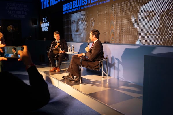 Atlanta Journal-Constitution reporter Greg Bluestein talks with Sen. Jon Ossoff at the AJC Headline House event Friday, Dec. 19, 2025. (Kitchen Table for the AJC)