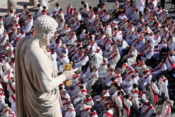 Clergy take their seats for the funeral of Pope Francis in St. Peter's Square at the Vatican, Saturday, April 26, 2025. (AP Photo/Markus Schreiber)
