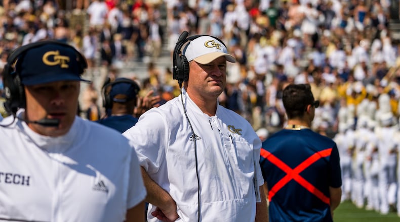 Georgia Tech interim coach Brent Key (white cap) stands on the sideline at the Yellow Jackets' game vs. Ole Miss Sept. 17, 2022 at Bobby Dodd Stadium. It proved the final home game as head coach for Geoff Collins (foreground). (Danny Karnik/Georgia Tech Athletics)