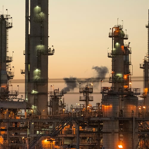 FILE - Lights illuminate an oil refinery in Carson, Calif., May 29, 2024. (AP Photo/Damian Dovarganes, File)