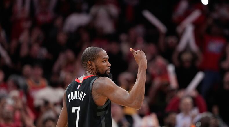 Houston Rockets' Kevin Durant (7) celebrates after making a game-winning 3-point basket against the Phoenix Suns during the second half of an NBA basketball game Monday, Jan. 5, 2026, in Houston. (AP Photo/David J. Phillip)