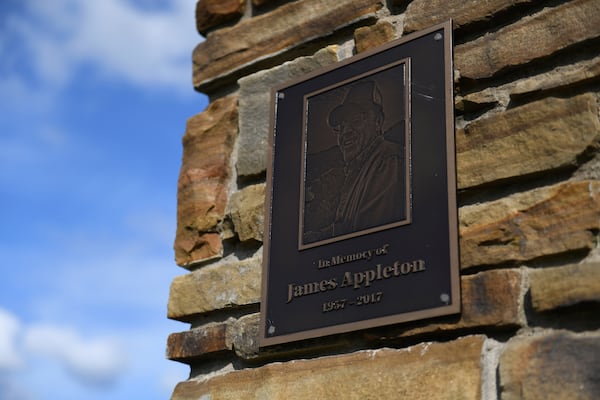 A plaque honoring water department employee James Appleton, who was fatally shot in 2017, hangs at the entrance of Gateway City Park in Gateway, Ark. on May 28, 2026. (AP Photo/Nick Ingram)