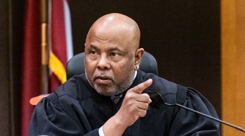 Fulton County Chief Judge Ural Glanville speaks to the jury ahead of opening statements at Fulton County Courthouse on Monday, Nov. 27, 2023.   (Steve Schaefer/steve.schaefer@ajc.com)