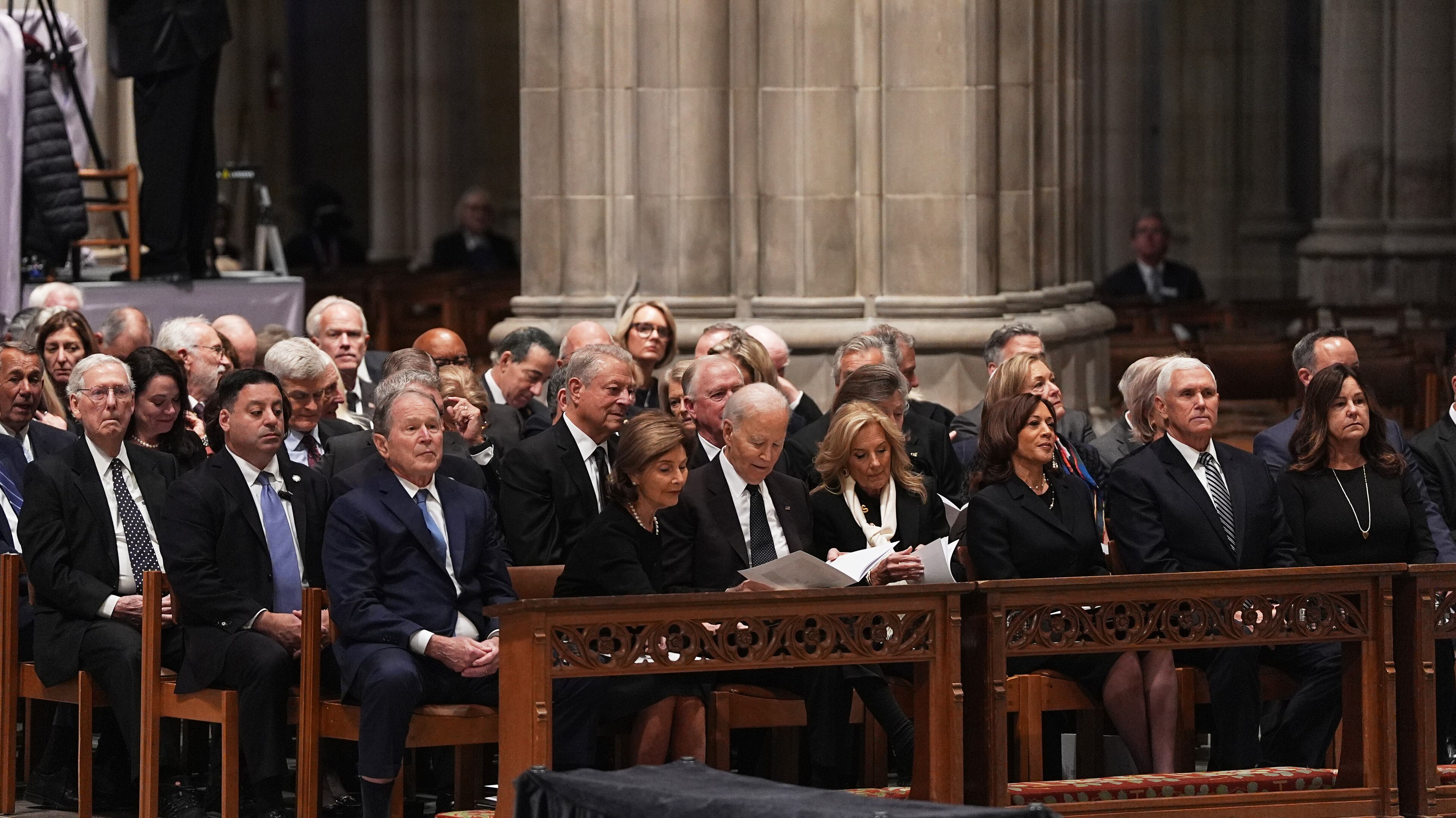 Former Presidents front row from left, George W. Bush with Laura Bush, Joe Biden with Jill Biden and former Vice Presidents Kamala Harris and Mike Pence with Karen Pence, front right, and other invited guests, are seated during the funeral for former Vice President Dick Cheney at the Washington National Cathedral on Thursday, Nov. 20, 2025 in Washington. (AP Photo/Matt Rourke)