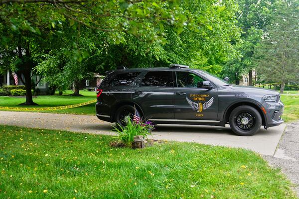 An Ohio State Highway Patrol car blocks access to a driveway in Howland, Monday, June 30, 2025, near where a day earlier a plane crashed on take off killing all onboard. (AP Photo/Sue Ogrocki)
