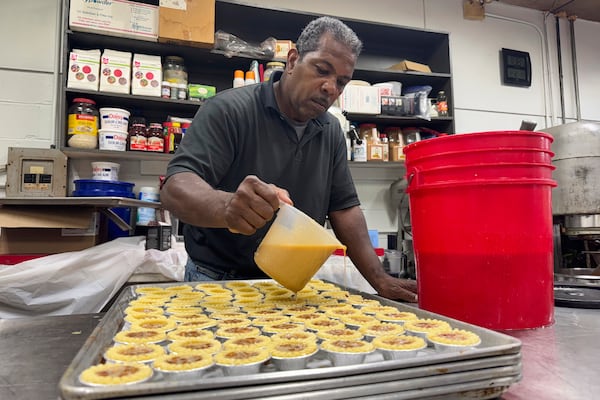 Jerry Clifton, 56, a Loretta's Pralines baker, prepares confections on Tuesday, April 22, 2025, for the New Orleans Jazz and Heritage Festival. (AP Photo/Jack Brook)