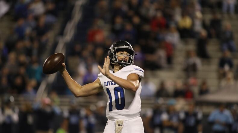 Centennial quarterback Max Brosmer (10) attempts a pass in the second half against Pope at Pope High School Friday, October 27, 2017, in Marietta, Ga. Centennial won 45-17. PHOTO / JASON GETZ