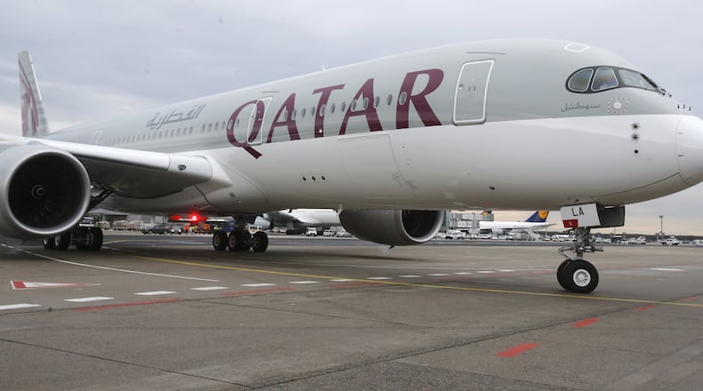 FILE- In this Jan. 15, 2015, file photo, a new Qatar Airways Airbus A350 approaches the gate at the airport in Frankfurt, Germany. As the indignities of modern air travel go, the latest ban on laptops and tablets on some international flights falls somewhere between having to take off your ratty shoes at the security checkpoint and having your baby food and milk tested for bomb residue. It's yet another inconvenience in the name of security for weary travelers, especially those from or passing through the 10 mostly Middle Eastern and North African countries covered by new U.S. and British policies. (AP Photo/Michael Probst, File)