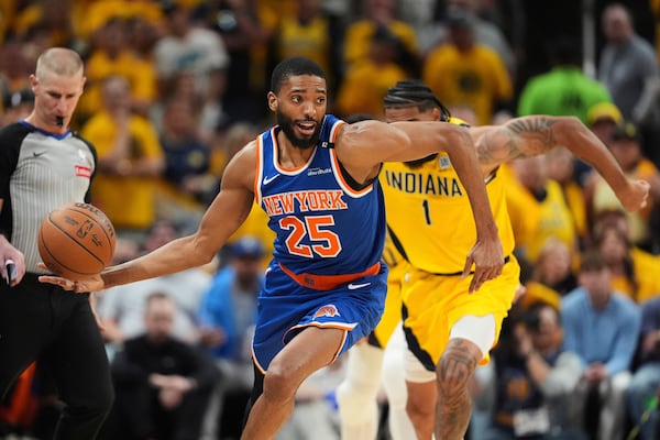 New York Knicks forward Mikal Bridges (25) controls the ball during the second half of Game 6 of the Eastern Conference finals of the NBA basketball playoffs against the Indiana Pacers in Indianapolis, Saturday, May 31, 2025. (AP Photo/Michael Conroy)