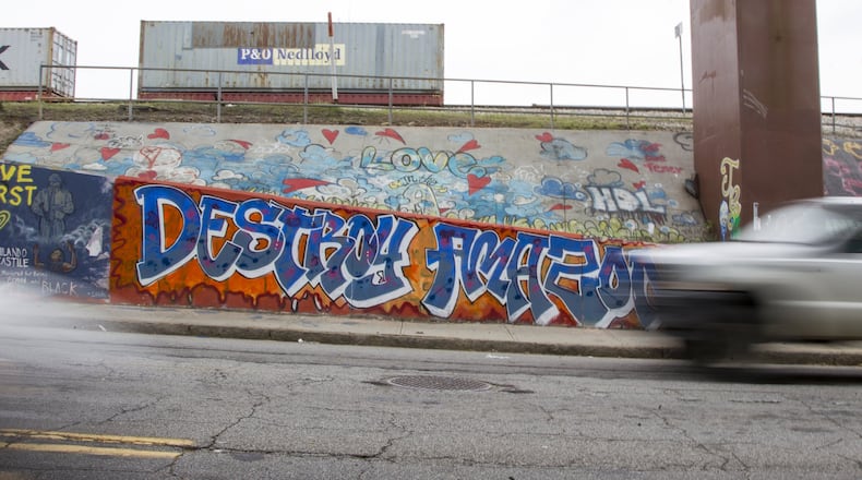 Graffiti opposing the possibility of Atlanta being chosen as Amazon’s second headquarters is shown near the Krog Street Tunnel in Atlanta, Georgia, on Wednesday, April 4, 2018. (REANN HUBER/REANN.HUBER@AJC.COM)