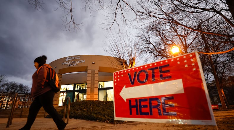 A person walks outside Joan P. Garner Library at Ponce De Leon in Dekalb on Monday, Feb 19, 2024. Three commissioners are vying to be DeKalb's next chief executive officer.