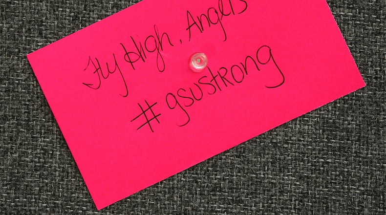 A note written by a student is posted on the "Memory Wall" for five nursing students who died April 22, 2015, in Statesboro. Curtis Compton / ccompton@ajc.com