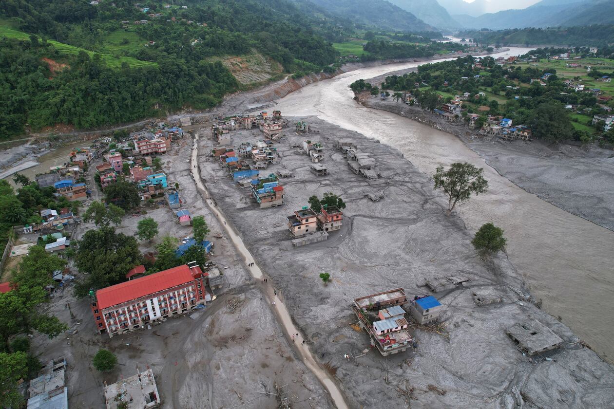 FILE - Homes are engulfed in mud in the aftermath of flash flooding along the Trishuli River in the Devighat area of Nuwakot district, Nepal, Aug. 29, 2026. (AP Photo/Rajesh Kumar Singh, File)