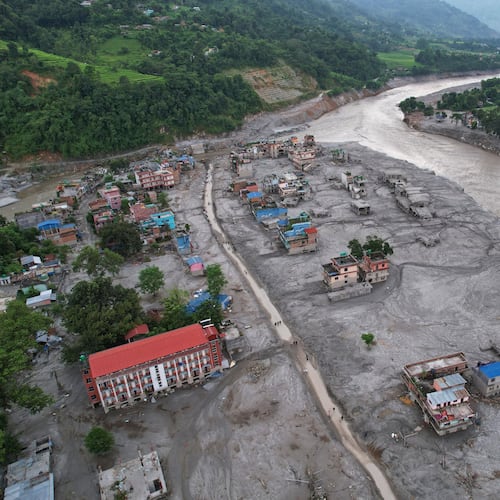 FILE - Homes are engulfed in mud in the aftermath of flash flooding along the Trishuli River in the Devighat area of Nuwakot district, Nepal, Aug. 29, 2026. (AP Photo/Rajesh Kumar Singh, File)