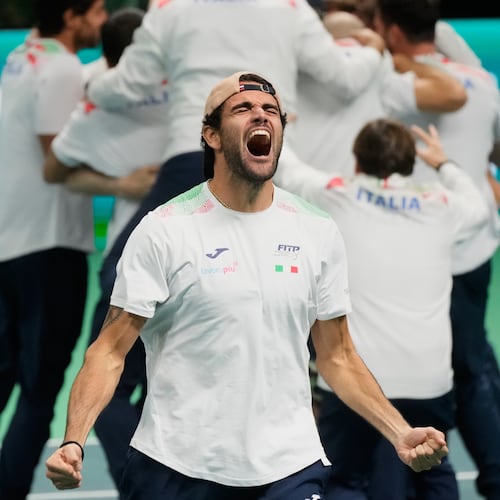 Italy's Matteo Berrettini, front, celebrates after Italy's Flavio Cobolli winning a Davis Cup final singles tennis match against Spain's Jaume Munar, in Bologna, Italy, Sunday, Nov. 23, 2025. (AP Photo/Luca Bruno)