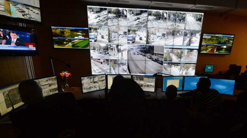 At the Atlanta police video integration center, officers keep watch over hundreds of video feeds coming in from cameras around the city. Kent D. Johnson / kdjohnson@ajc.com