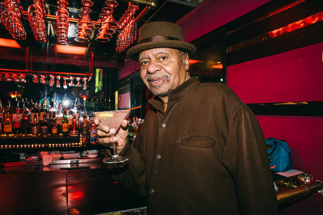 Ellery Murphy, age 70, enjoys a drink at his nightclub and lounge, Ellery's, in southwest Atlanta on Wednesday, Feb. 21, 2024. (Olivia Bowdoin for the AJC).