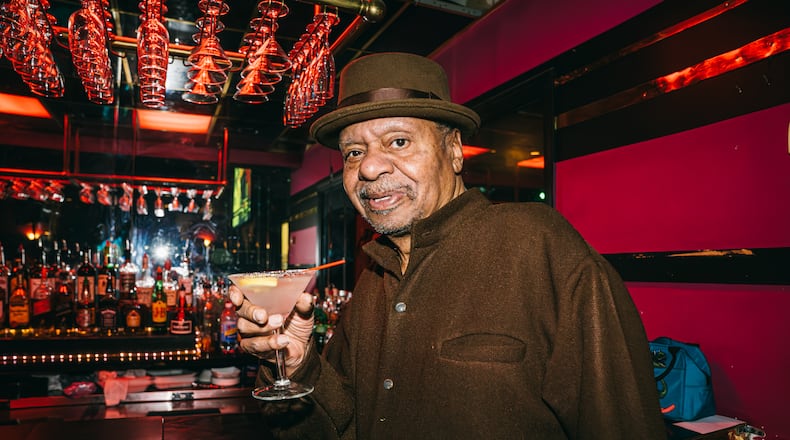 Ellery Murphy, age 70, enjoys a drink at his nightclub and lounge, Ellery's,  in southwest Atlanta on Wednesday, Feb. 21, 2024. (Olivia Bowdoin for the AJC).