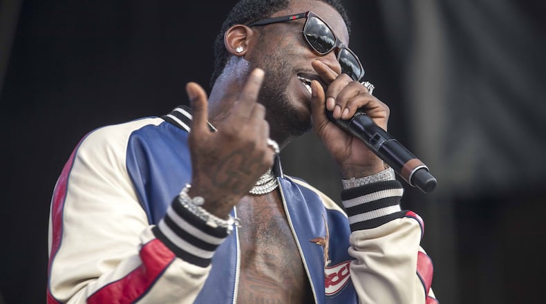 Gucci Mane, seen here performing at Music Midtown, will play halftime at the Hawks game March 26. ALYSSA POINTER/ALYSSA.POINTER@AJC.COM)