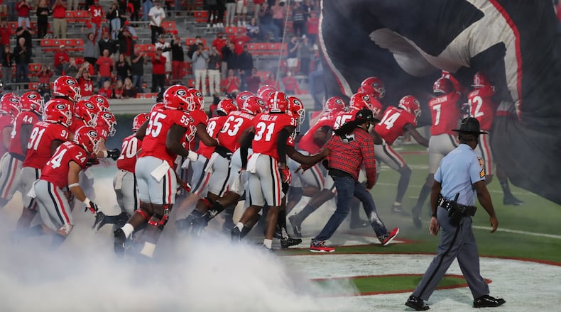 Georgia players run on to the field before Saturday's game at Sanford Stadium.