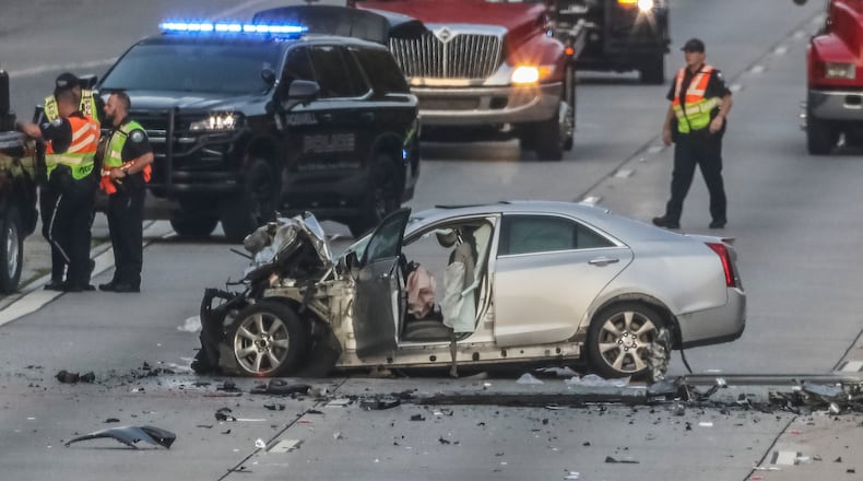 A fatal crash last June blocked all northbound lanes of Ga. 400 at Holcomb Bridge Road in Roswell. Georgia officials are looking for ways to combat the high death toll on the state's roads. (John Spink / John.Spink@ajc.com)