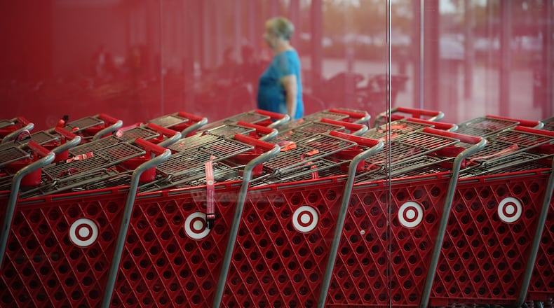 A shopper enters a Target store, Thursday, Aug. 13, 2026, in Woodbury, Minn. (AP Photo/Ellen Schmidt)