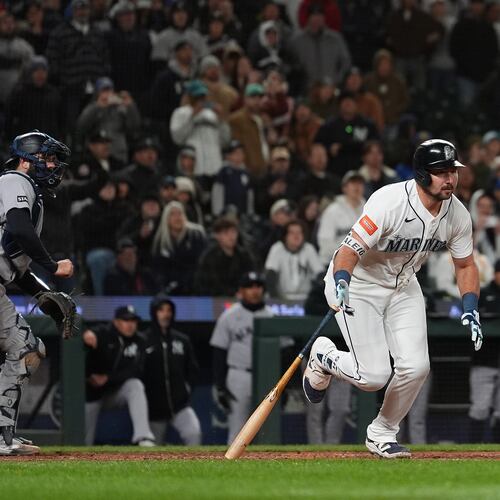 Seattle Mariners' Cal Raleigh hits a game-winning single during the ninth inning of a baseball game against the New York Yankees, Monday, March 30, 2026, in Seattle. (AP Photo/Lindsey Wasson)