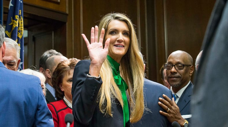 12/04/2019 -- Atlanta, Georgia -- Newly appointed U.S. Senator Kelly Loeffler waves toward supporters following a press conference in the Governor's office at the Georgia State Capitol Building, Wednesday, December 4, 2019. Georgia Gov. Brian Kemp appointed Kelly Loeffler to the U.S. Senate to take the place of U.S. Senator Johnny Isakson, who is stepping down for health reasons. (ALYSSA POINTER/ALYSSA.POINTER@AJC.COM)