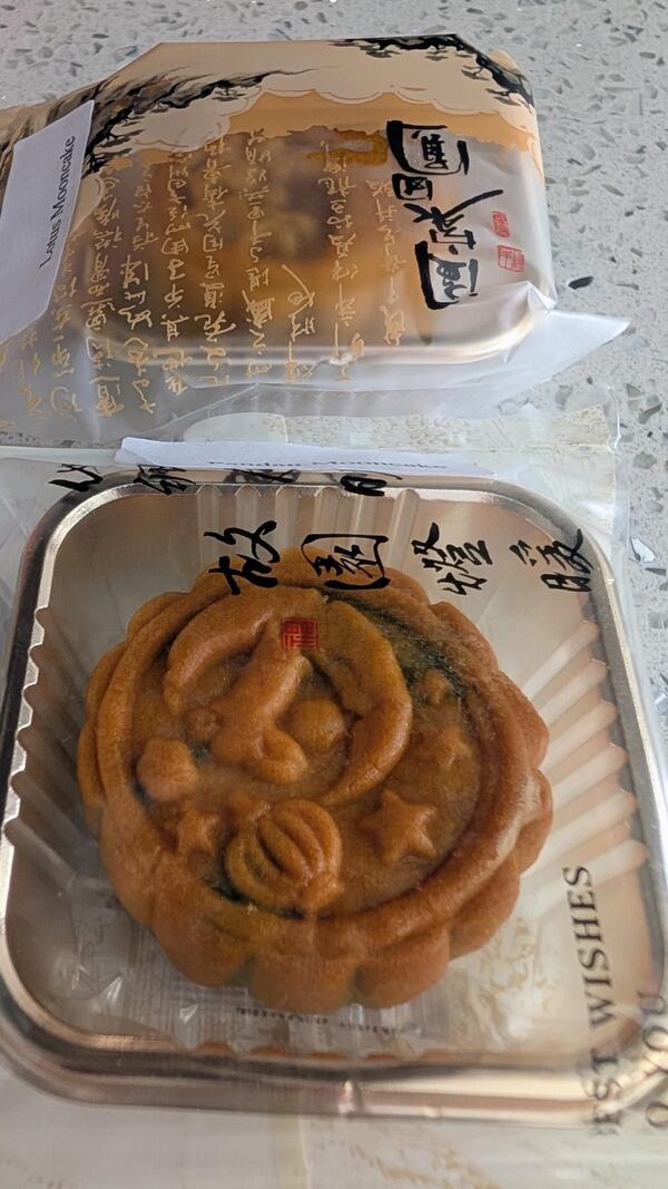 Packaged traditional lotus paste mooncake from Family Baking in Chamblee on a table