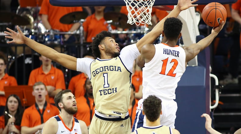 CHARLOTTESVILLE, VA - FEBRUARY 27: De'Andre Hunter #12 of the Virginia Cavaliers shoots past James Banks III #1 of the Georgia Tech Yellow Jackets in the first half during a game at John Paul Jones Arena on February 27, 2019 in Charlottesville, Virginia. (Photo by Ryan M. Kelly/Getty Images)