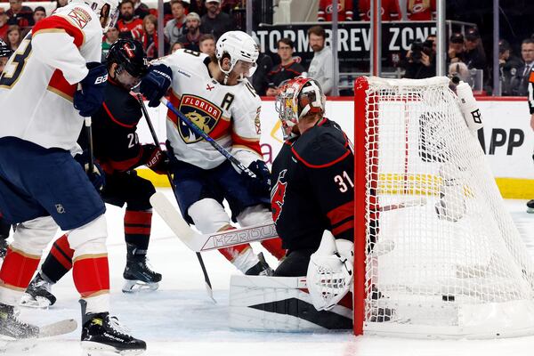 Florida Panthers' Matthew Tkachuk (19) slips the puck past Carolina Hurricanes goaltender Frederik Andersen (31) for a goal during the first period of Game 2 of the NHL hockey Stanley Cup Eastern Conference finals in Raleigh, N.C., Thursday, May 22, 2025. (AP Photo/Karl DeBlaker)
