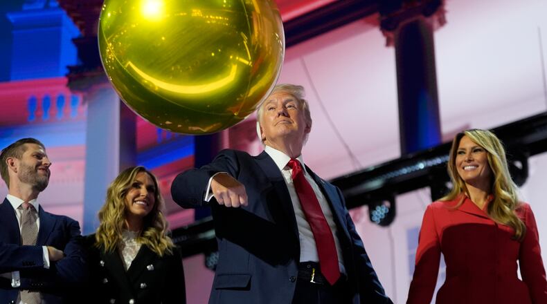 FILE - Republican presidential candidate former President Donald Trump hits a balloon during the final day of the Republican National Convention, July 18, 2024, in Milwaukee. (AP Photo/Paul Sancya, File)