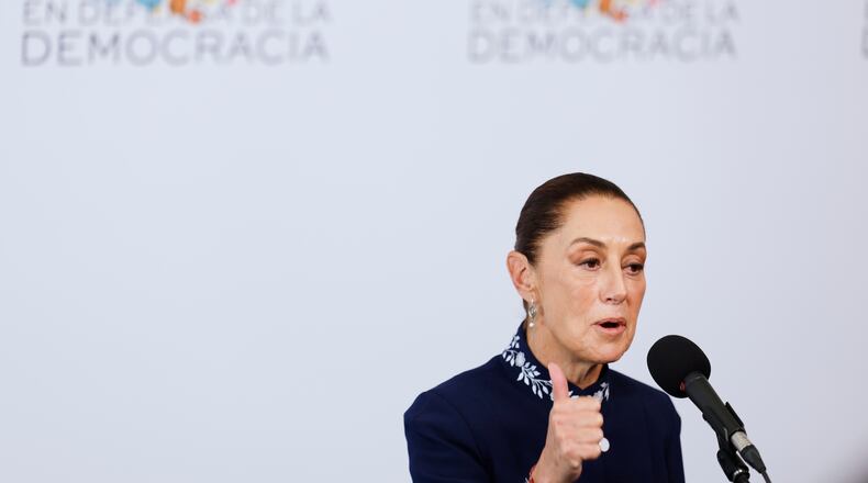 Mexican President Claudia Sheinbaum addresses the media at the Meeting in Defence of Democracy summit, in Barcelona, Spain, Saturday, April 18, 2026. (AP Photo/Joan Monfort)