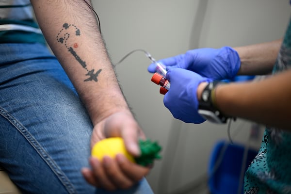Fernando Hermida has blood drawn for testing at Pineapple Healthcare in Orlando, Florida. Georgia, Florida and Texas would each see their health sector’s overall revenues decline by 4.8% in 2026, according to the forecast, the worst in the nation. The national loss would be about $32 billion.. (Phelan M. Ebenhack/AP)