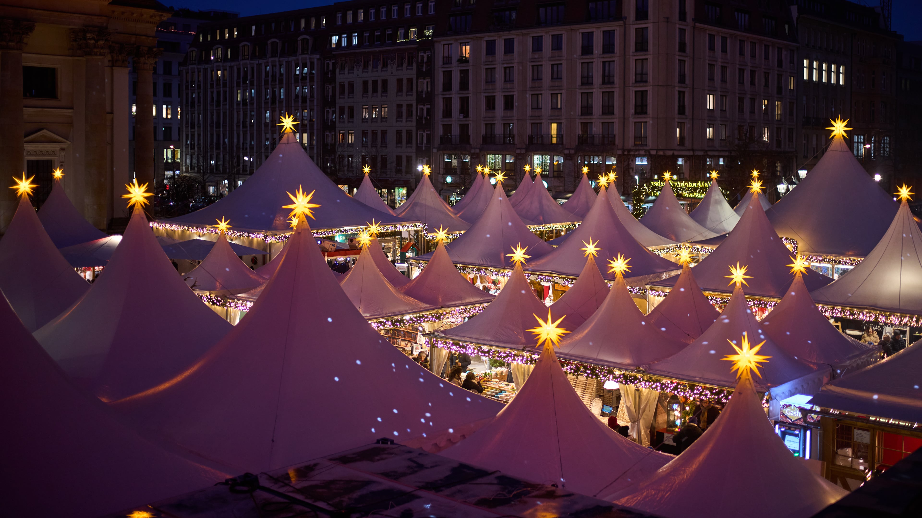 Lights illuminate the Christmas market at the Gendarmen Markt square in Berlin, Germany, Monday, Nov. 24, 2025. (AP Photo/Markus Schreiber)