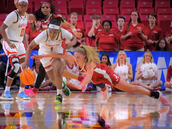 Maryland guard Sarah Te-Biasu is charged with a foul while trying to steal the ball from Alabama guard Sarah Ashlee Barker in the second round of the NCAA college basketball tournament, Monday, March 24, 2025, in College Park, Md. (Karl Merton Ferron/The Baltimore Sun via AP)