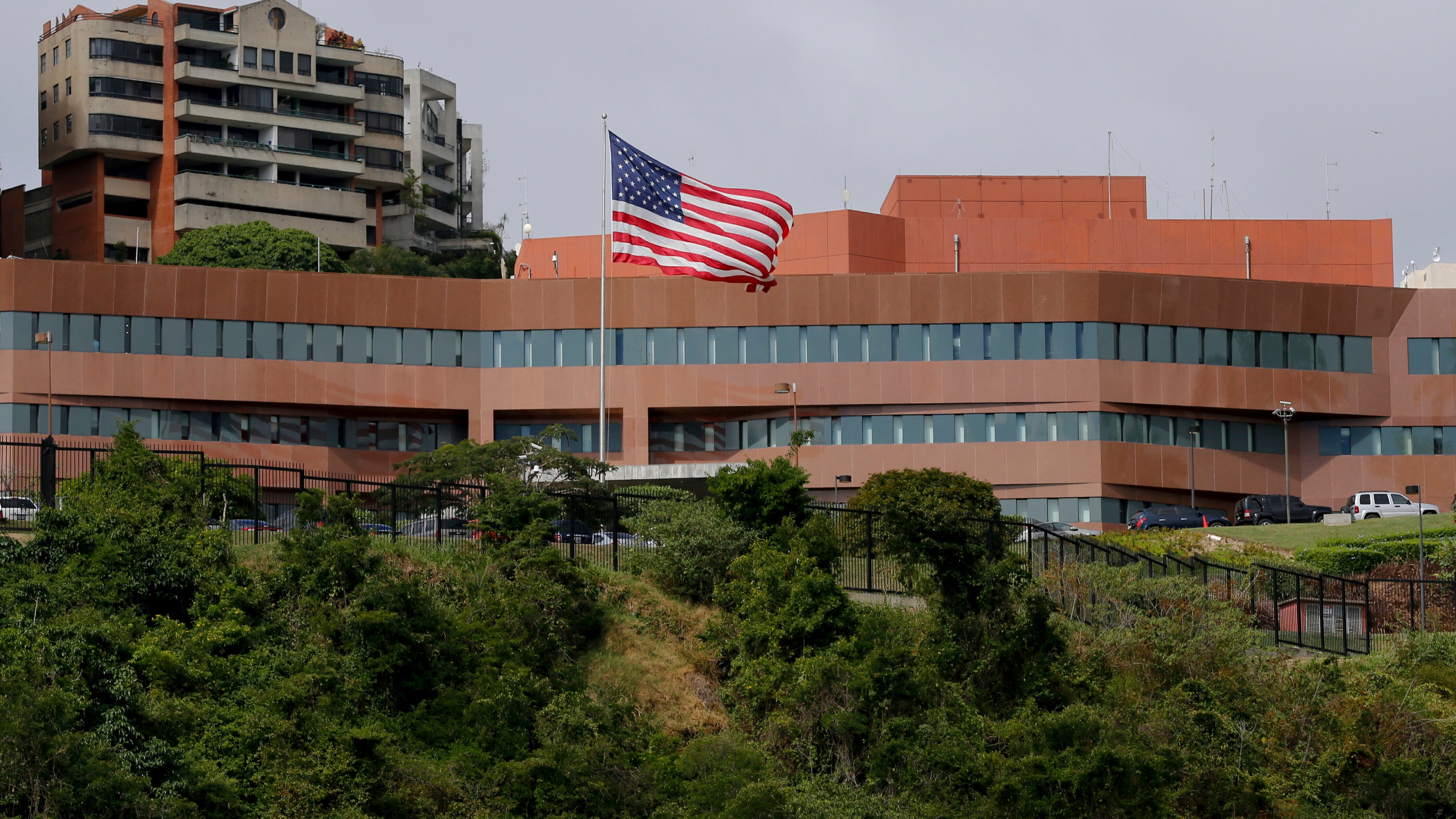 FILE - The U.S flag flies outside the U.S. embassy in Caracas, Venezuela, Jan. 24, 2019. (AP Photo/Fernando Llano, File)