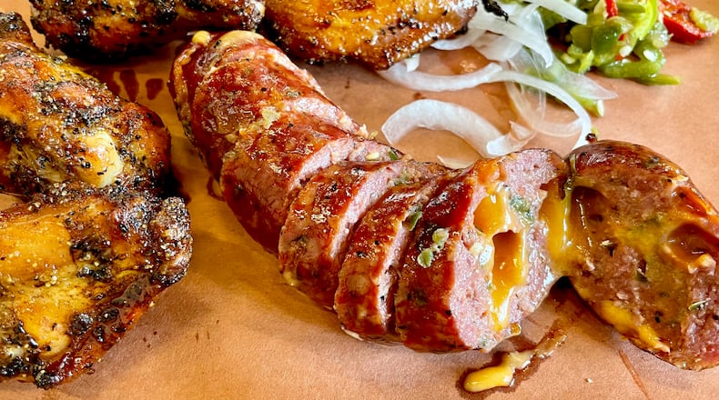 It takes three to four days to prepare the jalapeño and cheddar sausages at Owens & Hull. (Angela Hansberger for The Atlanta Journal-Constitution)