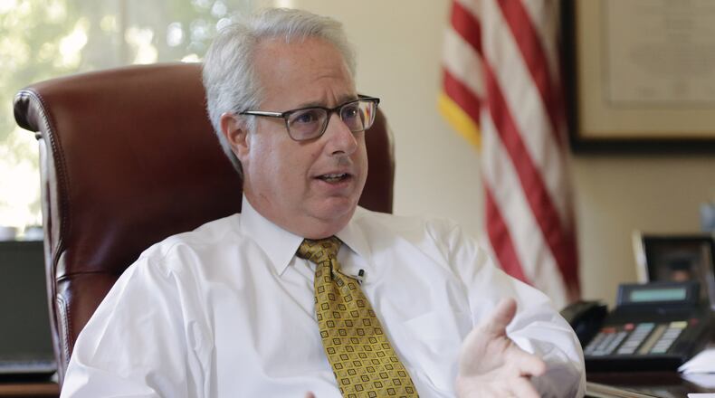 Georgia Attorney General Sam Olens discusses his transition to becoming Kennesaw State University president on Nov. 1. BOB ANDRES /BANDRES@AJC.COM
