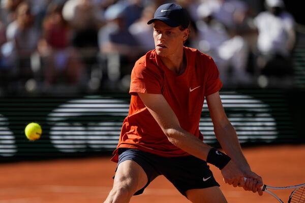 FILE - Italy's Jannik Sinner plays a shot against Spain's Carlos Alcaraz during their semifinal match of the French Open tennis tournament at the Roland Garros stadium in Paris, Friday, June 7, 2024. (AP Photo/Thibault Camus, File)