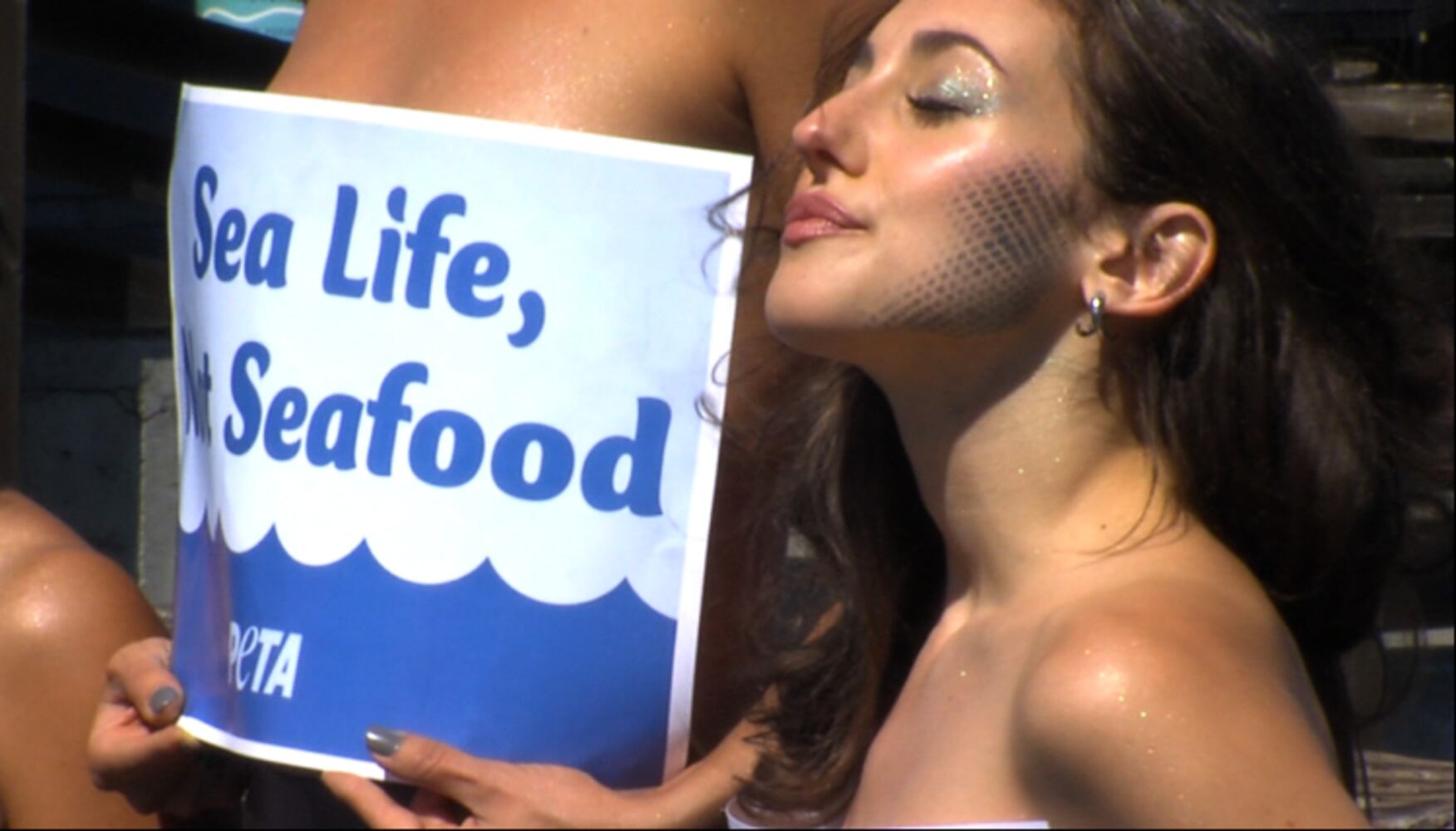PETA and topless mermaids against seafood