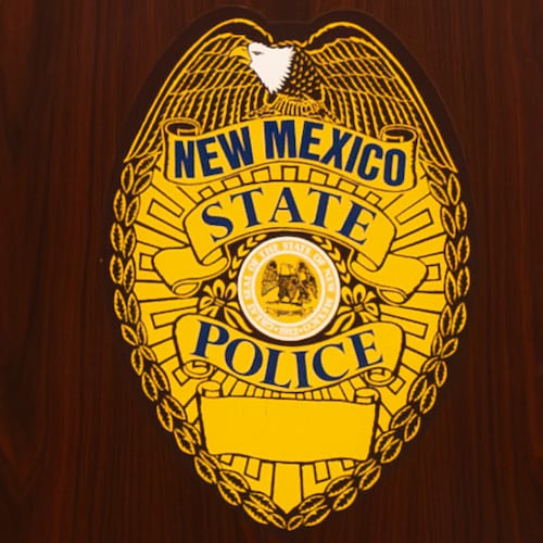FILE - A New Mexico State Police emblem is displayed on podium during a news conference, March 16, 2024, in Albuquerque, N.M. (Jon Austria/The Albuquerque Journal via AP, File)